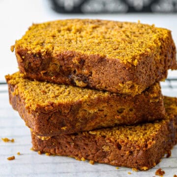 A stack of three slices of gluten free pumpkin loaf